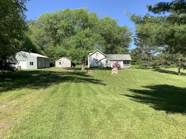view of yard with an outbuilding and a garage