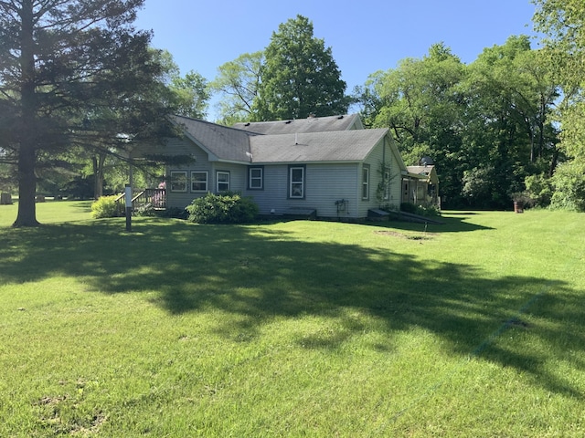 back of property with a yard