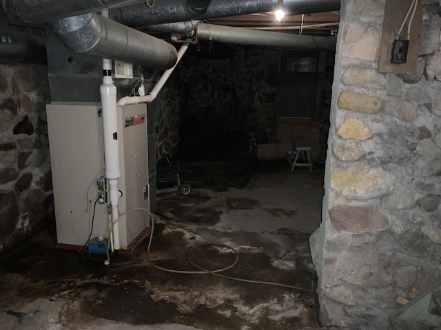 unfinished below grade area featuring heating unit
