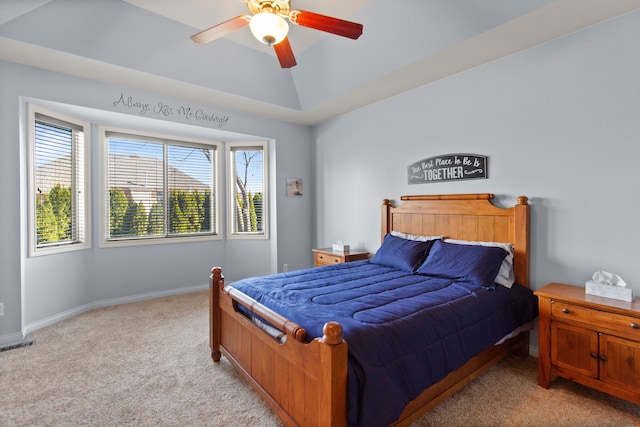bedroom featuring light carpet, a ceiling fan, visible vents, and baseboards