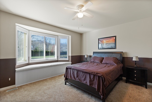bedroom featuring ceiling fan, carpet flooring, and visible vents