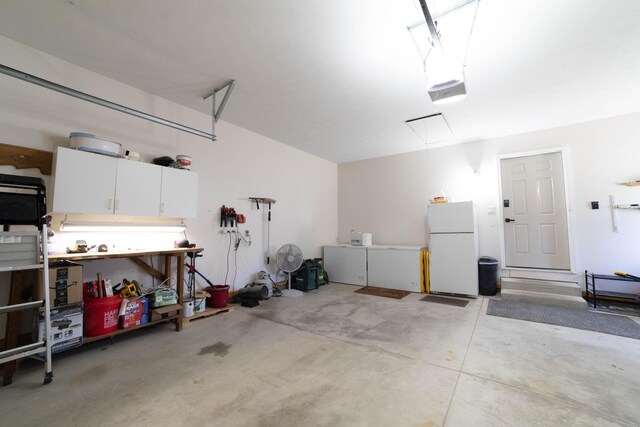 333 Quarterline St, Newaygo, MI 49337 - garage with freestanding refrigerator and a garage door opener