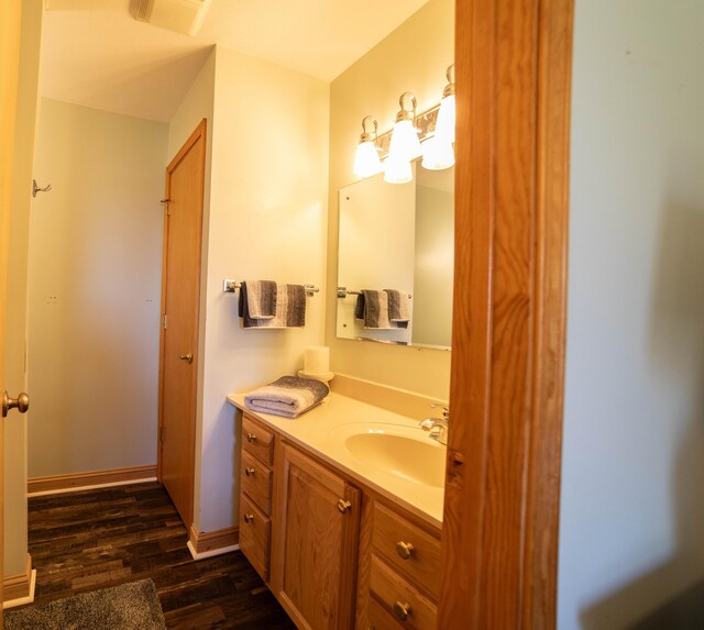 333 Quarterline St, Newaygo, MI 49337 - bathroom featuring vanity, wood finished floors, and visible vents