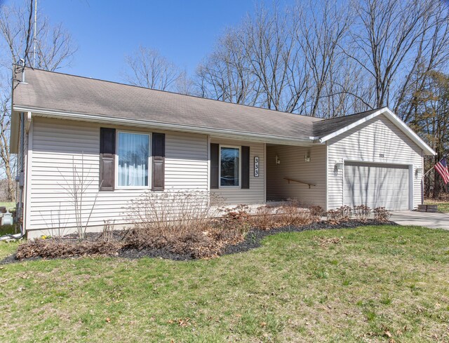 333 Quarterline St, Newaygo, MI 49337 - ranch-style house with an attached garage, a front lawn, covered porch, and driveway