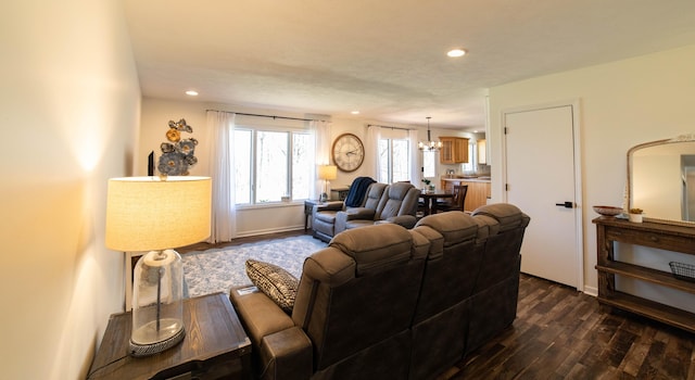 333 Quarterline St, Newaygo, MI 49337 - living room featuring baseboards, dark wood-style floors, recessed lighting, and a notable chandelier