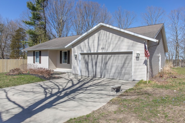 333 Quarterline St, Newaygo, MI 49337 - view of front of house with fence, driveway, roof with shingles, and a garage