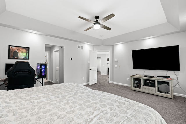bedroom with ceiling fan, carpet floors, visible vents, and baseboards