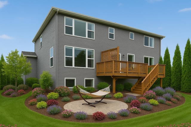 rear view of house featuring stairway, a deck, a patio, and a lawn