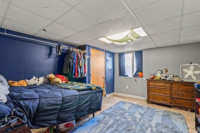 6545 Hiller Ave, Whitmore Lake, MI 48189 - tiled bedroom with a drop ceiling and baseboards