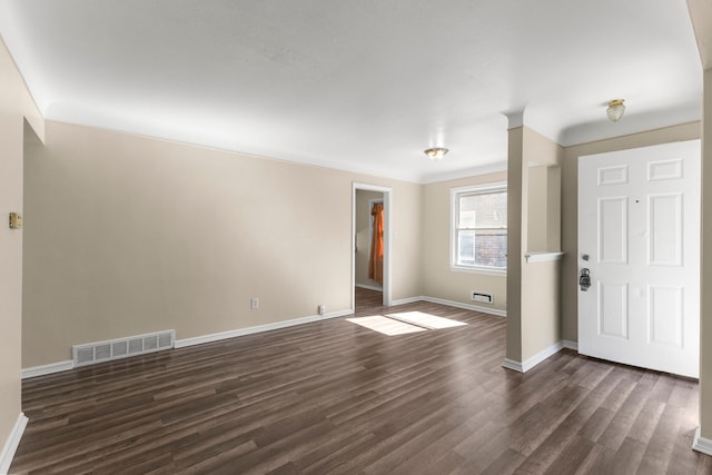 26488 Stollman Dr, Inkster, MI 48141 - foyer entrance featuring baseboards, visible vents, and dark wood finished floors