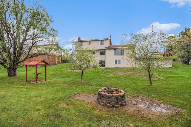 92 Brookfield Dr, Oxford, MI 48371 - view of green lawn with a fire pit
