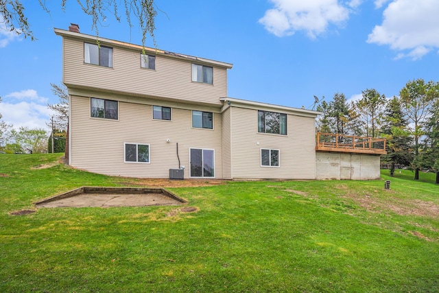 92 Brookfield Dr, Oxford, MI 48371 - back of property with a chimney, a lawn, central air condition unit, a deck, and a patio