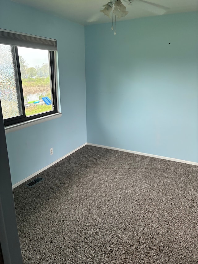 92 Brookfield Dr, Oxford, MI 48371 - spare room featuring ceiling fan, baseboards, and carpet floors