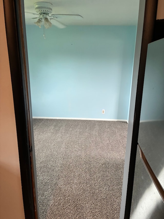 92 Brookfield Dr, Oxford, MI 48371 - spare room with a ceiling fan, carpet flooring, and baseboards