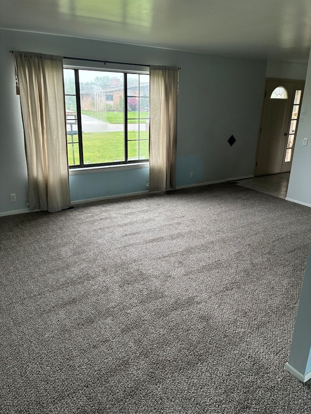 92 Brookfield Dr, Oxford, MI 48371 - carpeted empty room featuring baseboards