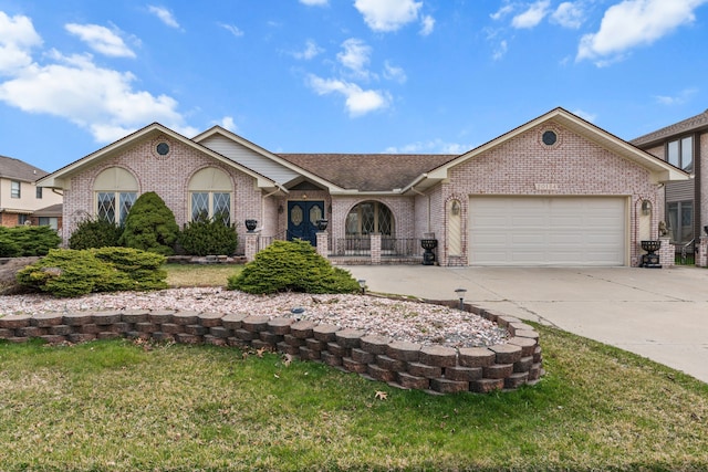 ranch-style home featuring roof with shingles, concrete driveway, an attached garage, brick siding, and a front yard