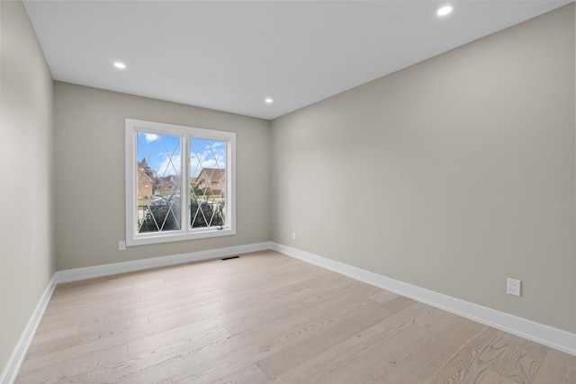 unfurnished room featuring recessed lighting, visible vents, and light wood finished floors