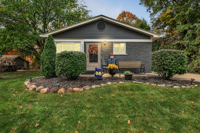 19737 Clement Rd, Northville, MI 48167 - view of front of property with a front lawn