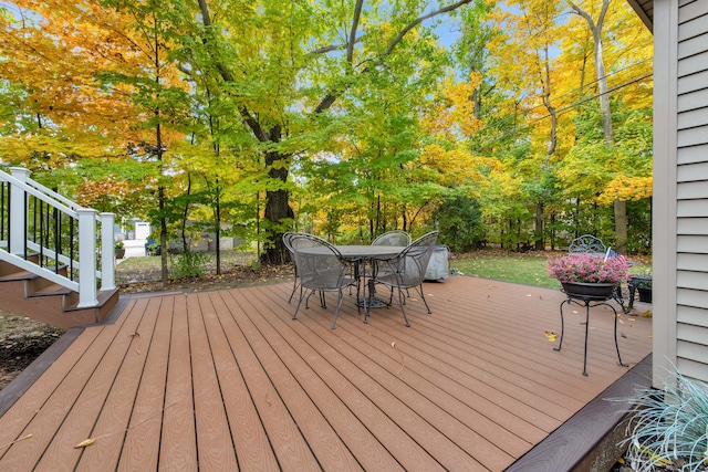 19737 Clement Rd, Northville, MI 48167 - wooden terrace with outdoor dining space and view of wooded area