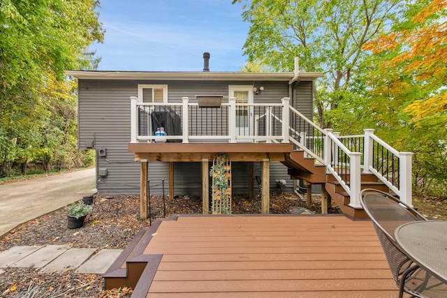 19737 Clement Rd, Northville, MI 48167 - back of property featuring a wooden deck and stairway