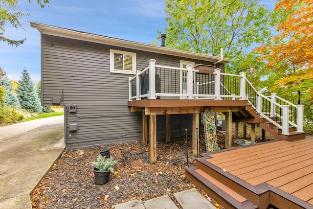 19737 Clement Rd, Northville, MI 48167 - back of house featuring a wooden deck and stairway