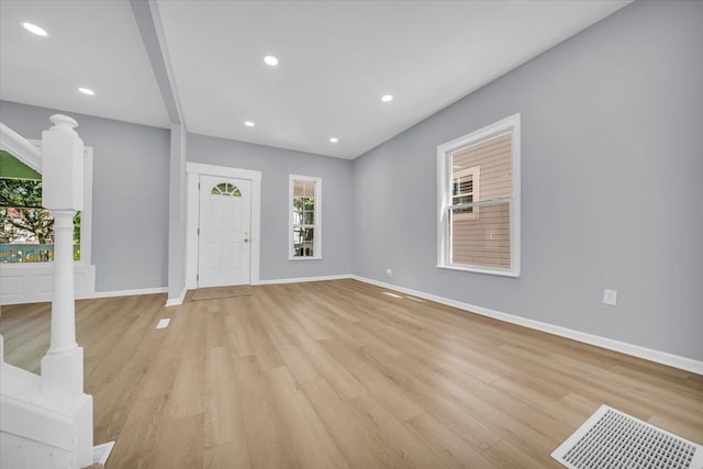 408 Mount Vernon St, Detroit, MI 48202 - entryway with baseboards, light wood-style flooring, and decorative columns