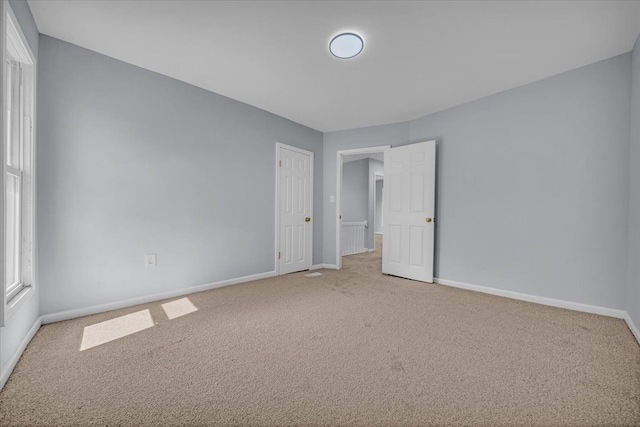 408 Mount Vernon St, Detroit, MI 48202 - unfurnished bedroom featuring baseboards and light colored carpet