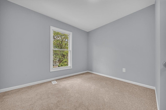408 Mount Vernon St, Detroit, MI 48202 - spare room featuring baseboards, visible vents, and carpet