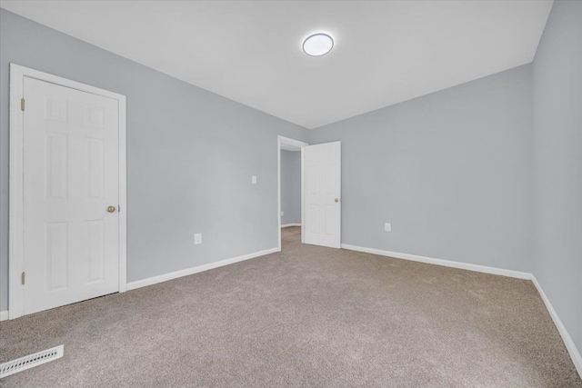 408 Mount Vernon St, Detroit, MI 48202 - unfurnished bedroom with baseboards, visible vents, and carpet