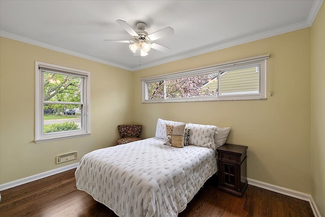 bedroom with baseboards, multiple windows, and ornamental molding