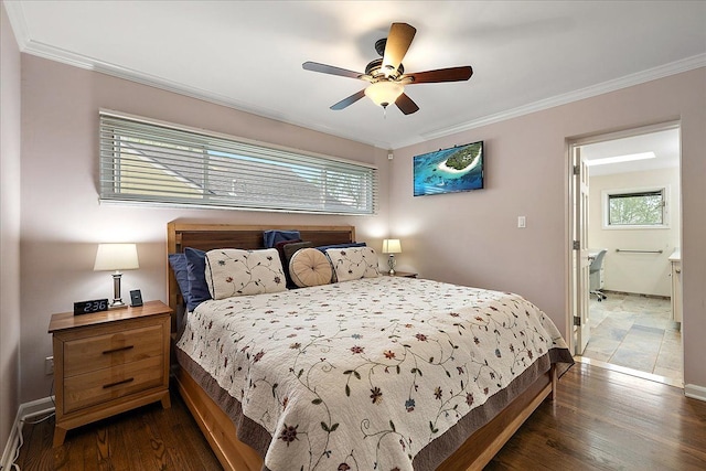 bedroom featuring baseboards, ornamental molding, and dark wood-style floors