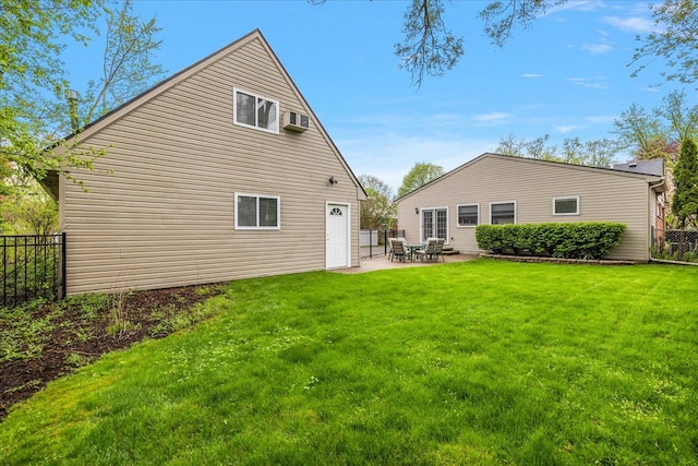 back of house with a yard, fence, a patio area, and a wall unit AC