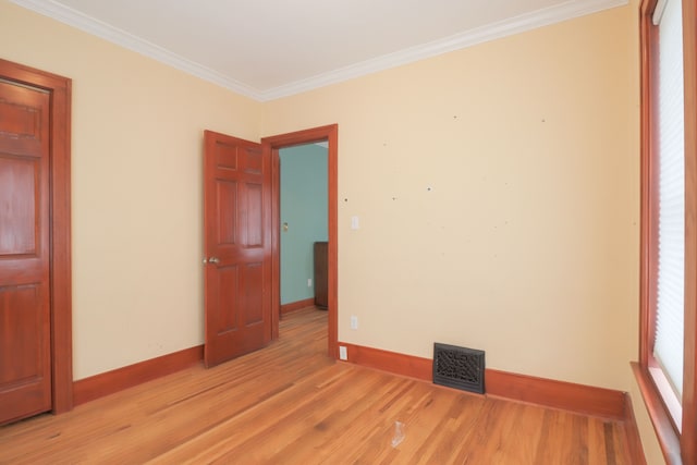 324 Albany St, Ferndale, MI 48220 - unfurnished room with light wood-style flooring, crown molding, and baseboards