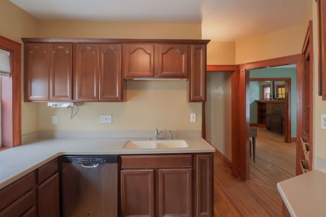 324 Albany St, Ferndale, MI 48220 - kitchen featuring stainless steel dishwasher, a sink, wood finished floors, and light countertops