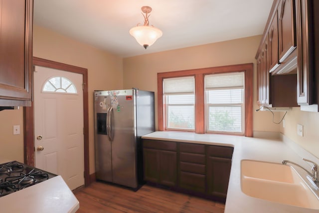 324 Albany St, Ferndale, MI 48220 - kitchen featuring stainless steel refrigerator with ice dispenser, a sink, dark wood finished floors, stovetop, and light countertops