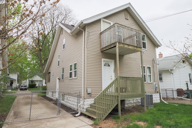 324 Albany St, Ferndale, MI 48220 - view of front of house featuring a balcony, central air condition unit, and a gate