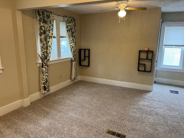 324 Albany St, Ferndale, MI 48220 - carpeted spare room with a ceiling fan, a textured ceiling, and a textured wall