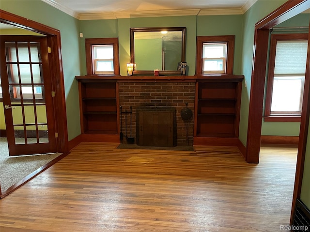 324 Albany St, Ferndale, MI 48220 - unfurnished living room featuring hardwood / wood-style floors, a fireplace, healthy amount of natural light, baseboards, and crown molding