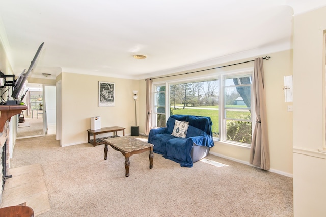 carpeted living room with baseboards
