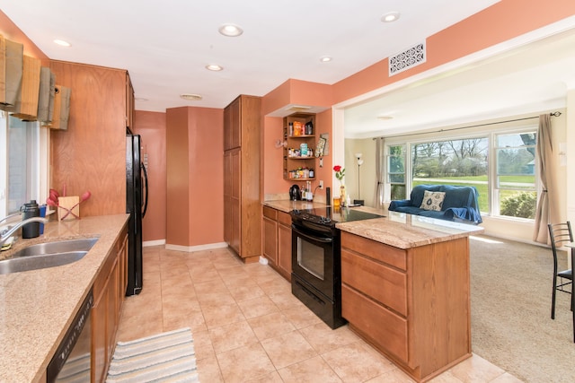 kitchen featuring a sink, brown cabinetry, black appliances, visible vents, and recessed lighting