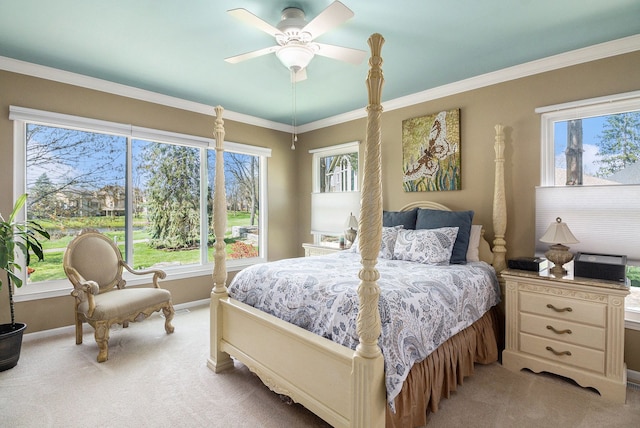 bedroom with baseboards, multiple windows, and light carpet