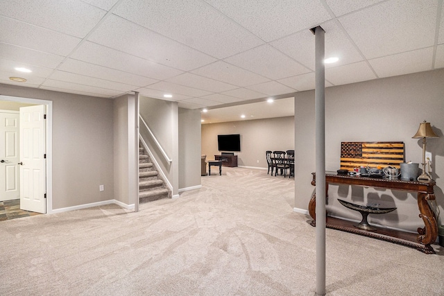 interior space featuring a paneled ceiling, stairs, carpet floors, baseboards, and recessed lighting