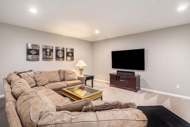 living area with baseboards, recessed lighting, and light colored carpet