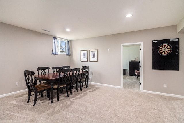 dining space featuring light colored carpet, baseboards, visible vents, and recessed lighting