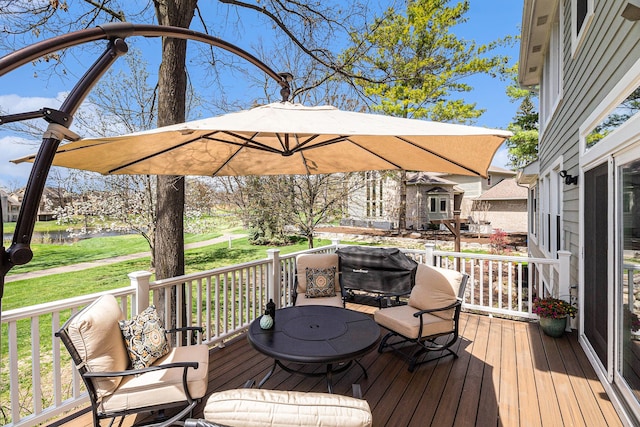 wooden terrace with a lawn