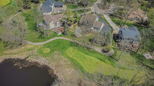 birds eye view of property featuring a water view, view of golf course, and a residential view