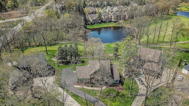 birds eye view of property with a residential view and a water view