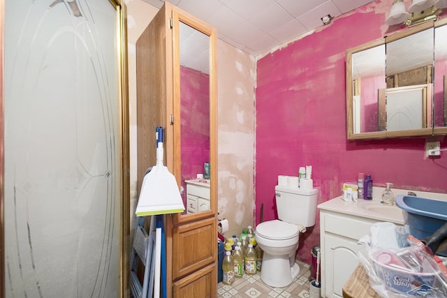bathroom featuring toilet and vanity