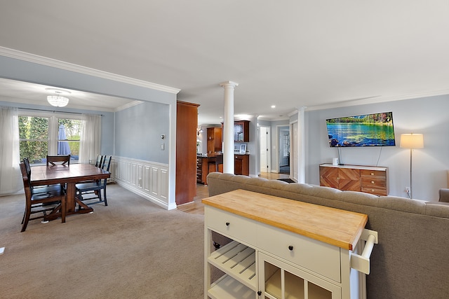 dining space featuring light colored carpet, decorative columns, ornamental molding, and recessed lighting