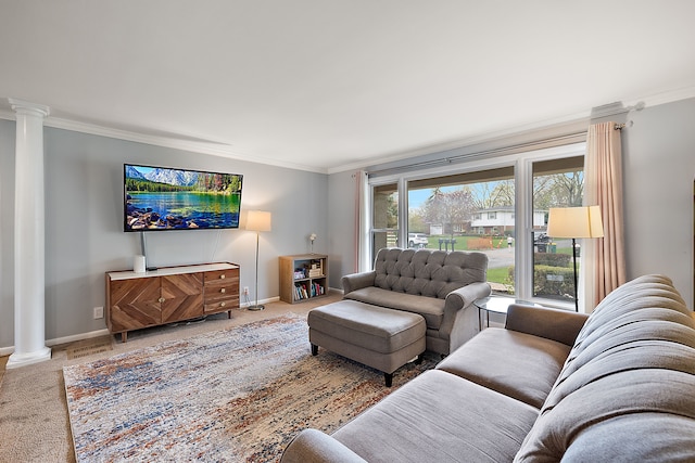carpeted living area with ornate columns, ornamental molding, and baseboards